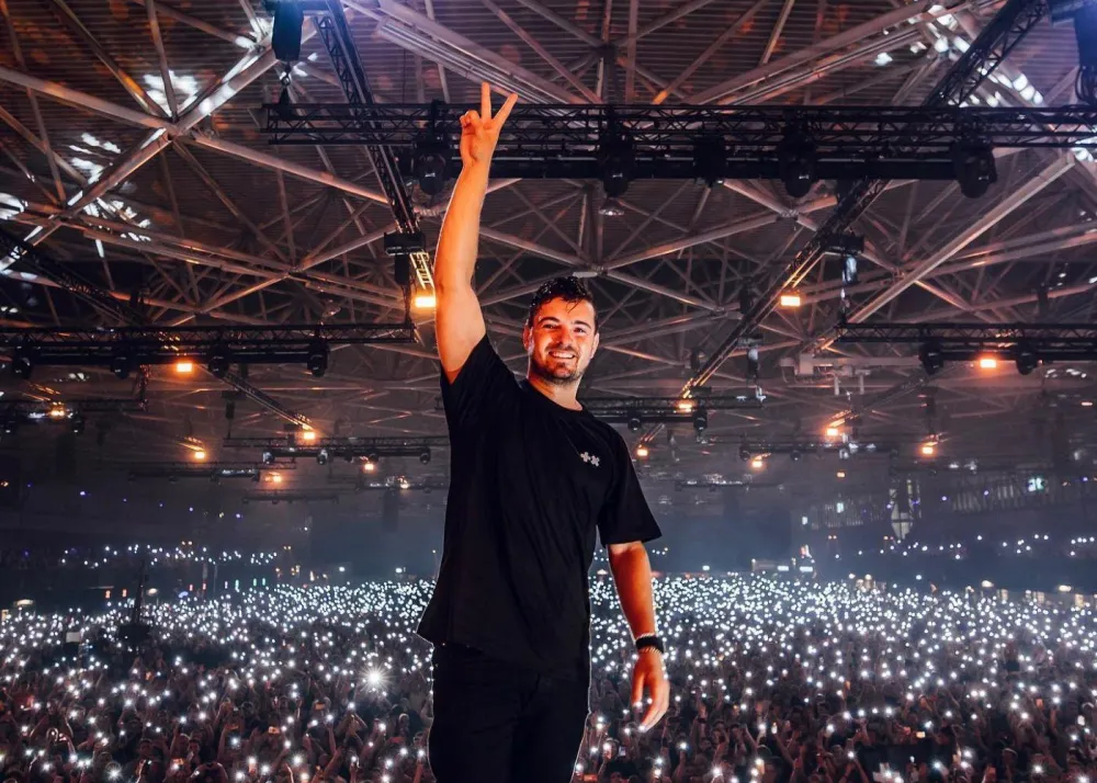 martin garrix on stage after performance with crowd in background, hong kong creamfields 2024 headliners