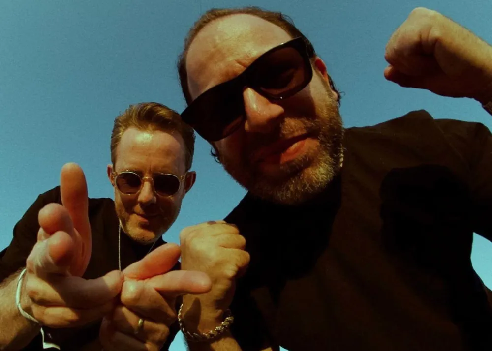 chase and status duo portrait with sunglasses and blue sky, hong kong creamfields 2024 headliners