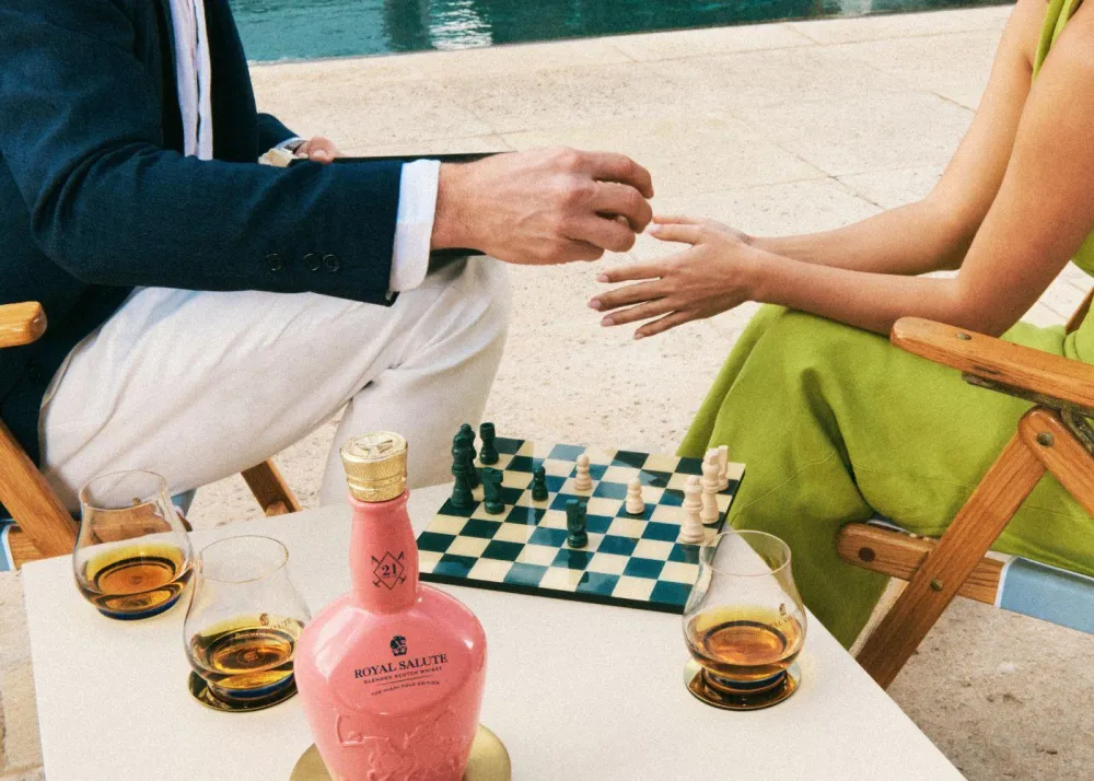 Chess playing while drinking Royal Salute