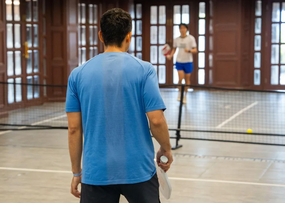 Guests playing pickleball at pop up pickleball court at Murray Summer event held at Murray House in Stanley
