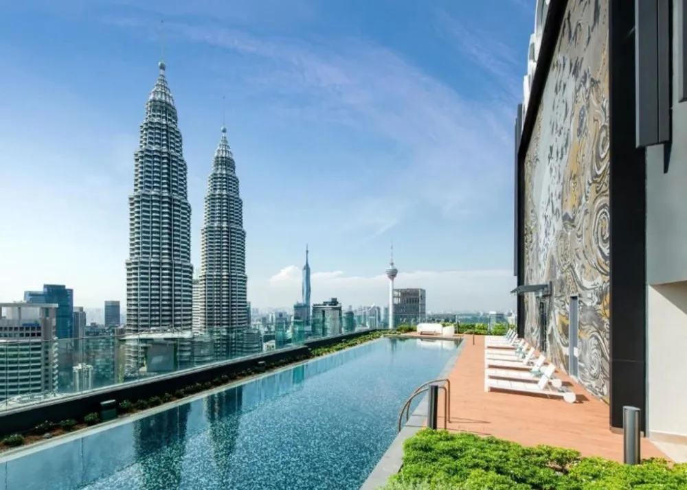 ascott hotel pool with the view of the twin towers right across