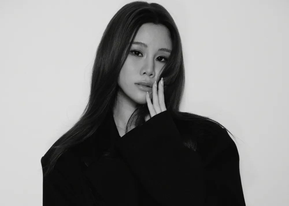 A portrait of a woman in black and gray