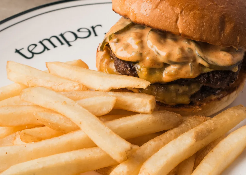 A burger with fries