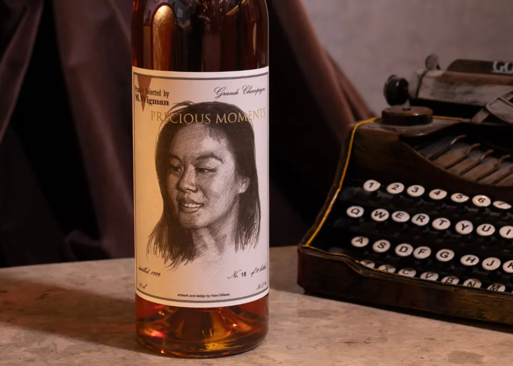 A bottle with a typewriter