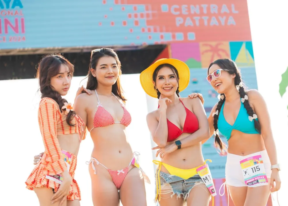 Bikini-clad runners posing for pictures