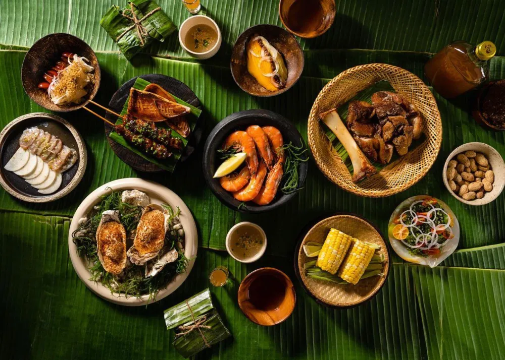 Kamayan-style eating laid out at Toyo Eatery, Manila is renowned for its dynamic food scene