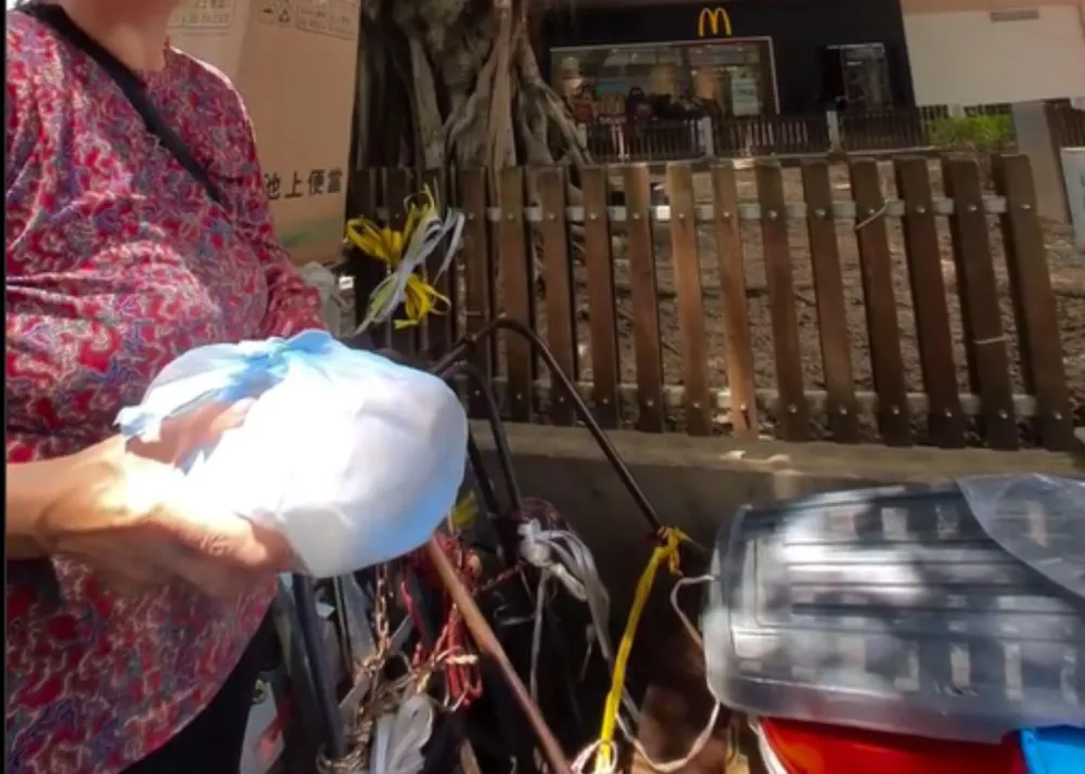 Screenshot of her reel, where she distributed meals to those in need