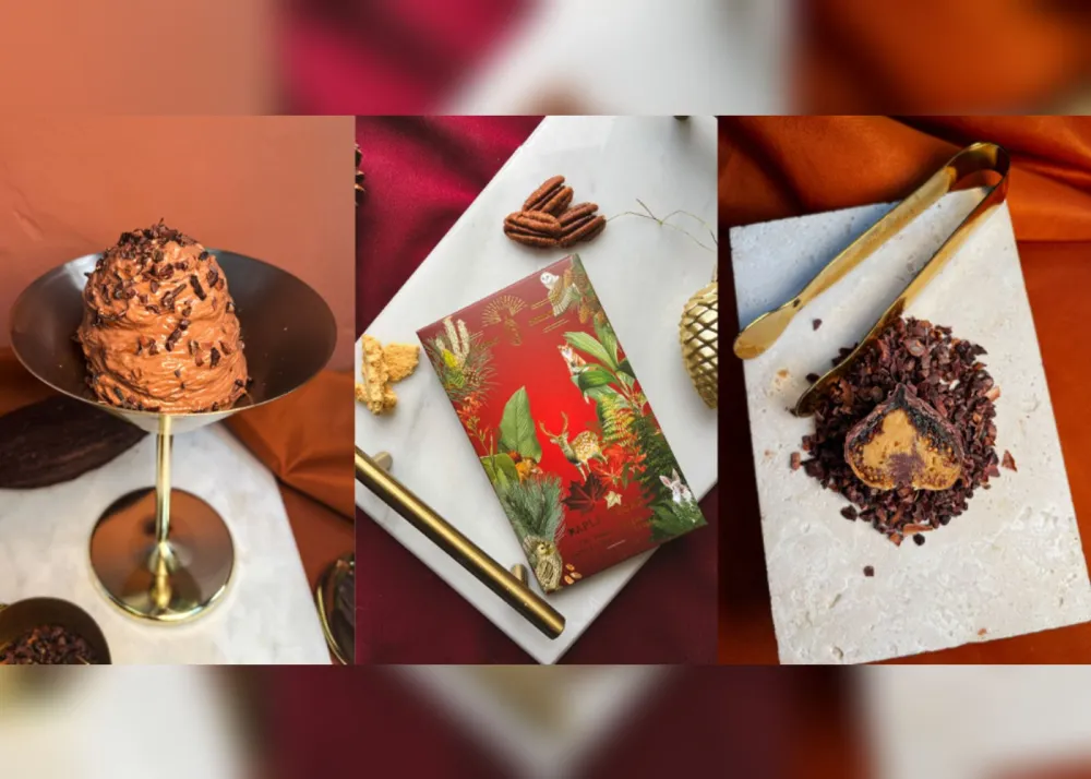 A bottle of wine and an open book resting on a wooden table, creating a cozy reading atmosphere.