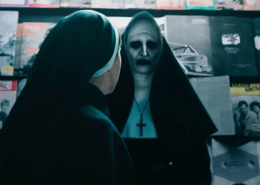 The Nun haunts Taissa Farmiga in The Nun II