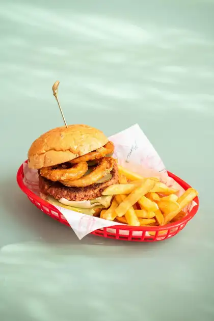 Mimi's Bangkok Vegan Burger With Onion Rings and Fries
