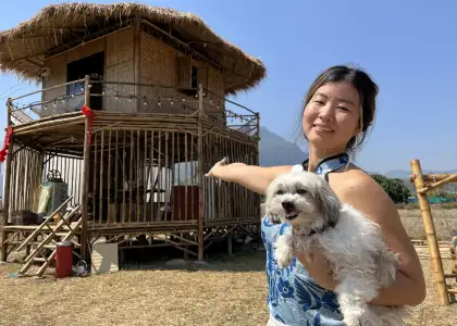 Yidan and her dog in the farm