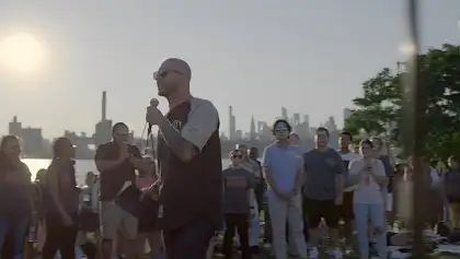 bald man using a mic
