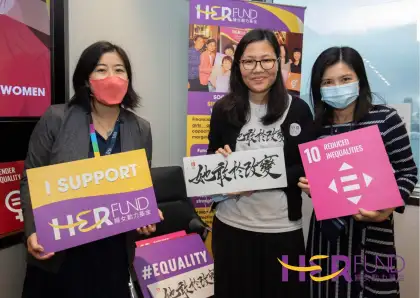 Women holding signages