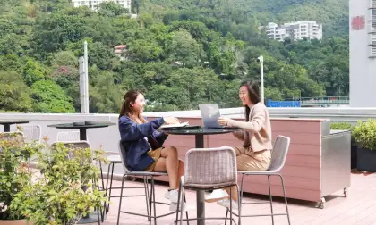 women sitting with laptop