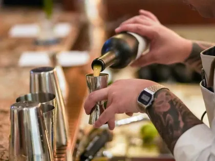 bartender using jigger