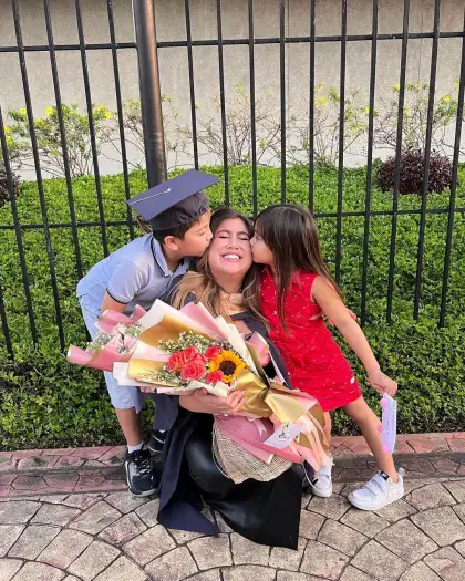 Nina at her graduation with her children