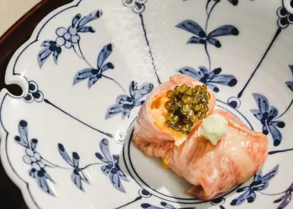 sushi with caviar on blue plating
