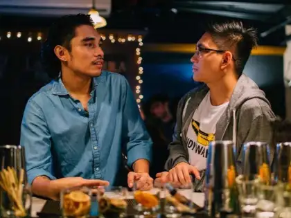 two guys having a drink