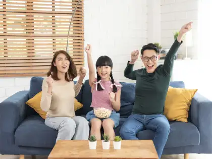 Family watching TV together
