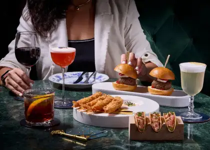 spread of savory delights and cocktails at The Stage