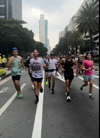 Marko runs with other run club members
