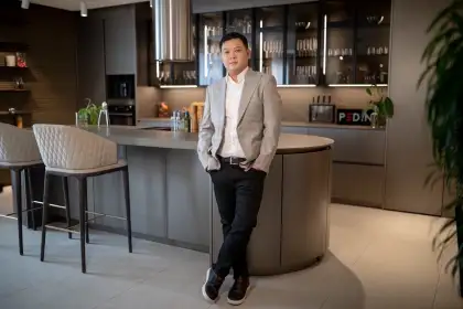 Moda Interni President and CEO Goldwin Sison and the beautiful custom Pedini kitchen showcasing its modular cabinetries and superior lacquering finishes