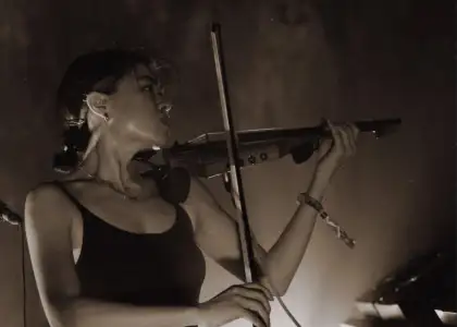 Xiaolin playing violin