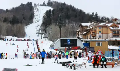 Skiers On Snowy Slopes With Picturesque Views And Icy Landscape