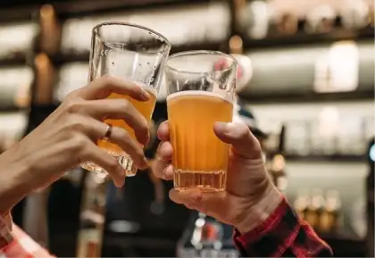 two beer drink being toast at The Point Lobby Lounge
