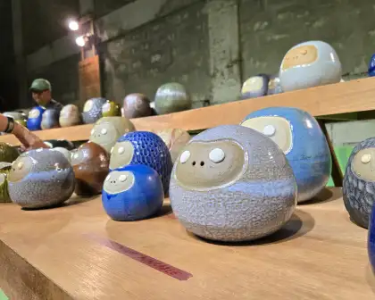 Jezzel Wee invites the audience to whisper into the ceramic dolls.