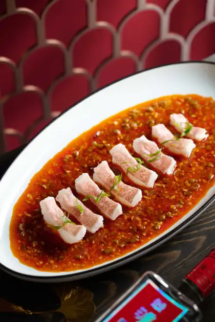 The long beans in the dish are pickled in a traditional Sichuan earthenware jar.