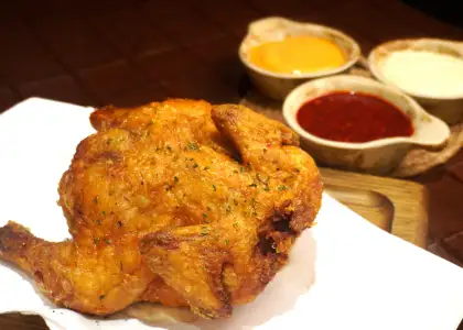 The OG National Fried Chicken is a fried whole chicken, meant to be shared with others.