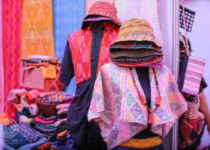 A booth selling textiles at the Salaam 2025: Halal Travel and Trade Expo