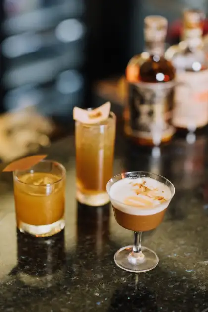 The three drinks at the bar takeover: the Wax (left), Oolong Tea Collin (center), and the Quinary Sour (right)