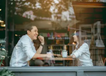 A picture of a couple enjoying coffee together