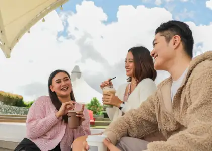 A group of friends enjoying coffee together at an SM Supermalls Sky Park