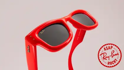 Bright red sunglasses against a neutral background