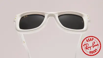 White sunglasses against a neutral background