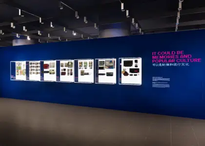An exhibition space with retro blue and pink