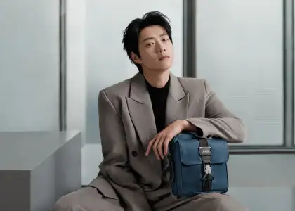 Wei Daxun modeling with a crossbody bag