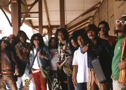 Different men dressed in different clothes in the same style