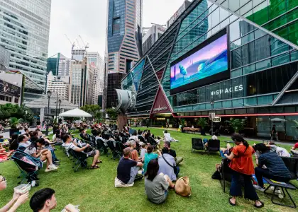 Group of people watching a movie outdoors