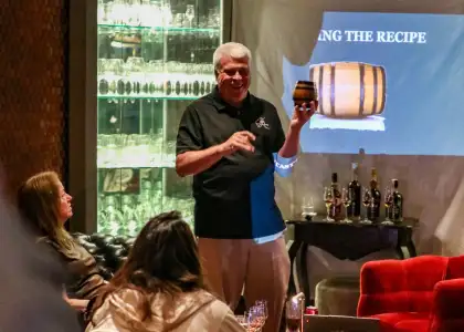 a person holding a barrel in front of others