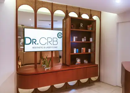 a tv screen with shelf showing the products of the clinic