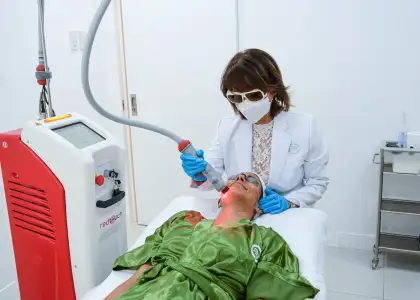 a dermatologist performing a treatment on a patient
