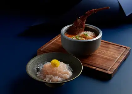 Half lobster and a bowl of rice