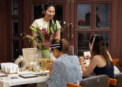 Guests participating in seashell charm workshop at pop-up event Murray Summer event held at Murray House in Stanley