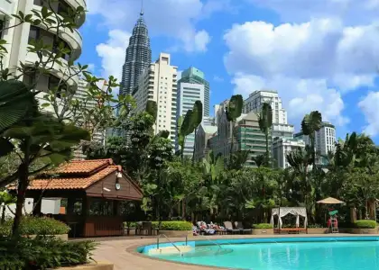 shangrila pool and trees, buildings and clouds