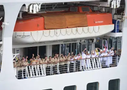 StarCruises’ “Star Voyager” inaugural voyage crew waving