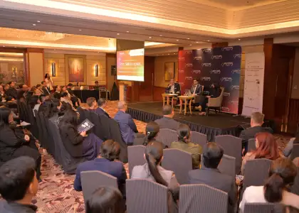 Crowd listening to a panel discussion